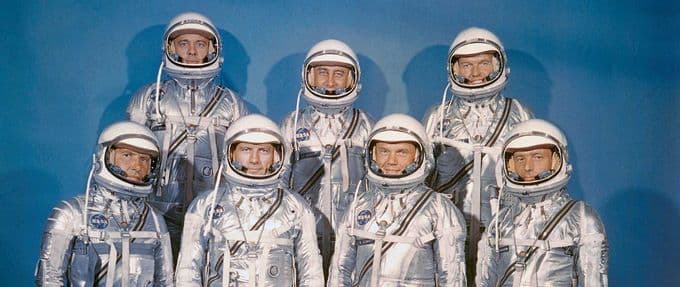 the mercury seven astronauts pose for a picture