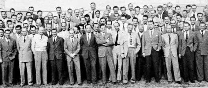 A large group picture of men in suits from the 1940s.