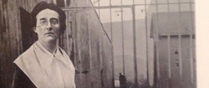 Louise Thuliez in front of jail bars