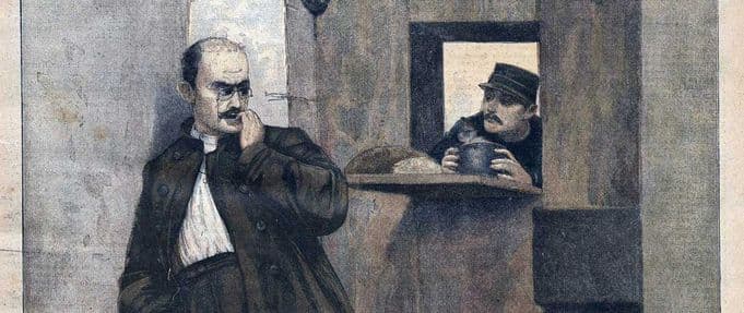 illustration from a magazine of alfred dreyfus in prison, with a guard giving him food